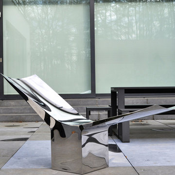 Outdoor instllation of furnitures in stainless steel polished