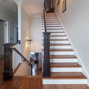 Inspiration for a timeless wooden wood railing staircase remodel in Other with painted risers