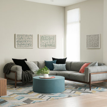 Contemporary Family Room with Grey Sectional and Floor-to-Ceiling Windows