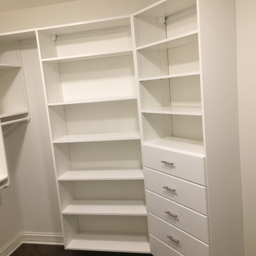 Master closet in white with 96" top shelf