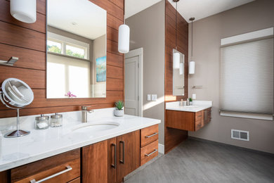 Inspiration for a mid-sized modern master gray tile and ceramic tile ceramic tile, gray floor, double-sink and shiplap wall freestanding bathtub remodel in Grand Rapids with flat-panel cabinets, medium tone wood cabinets, a one-piece toilet, an undermount sink, quartz countertops, white countertops and a floating vanity