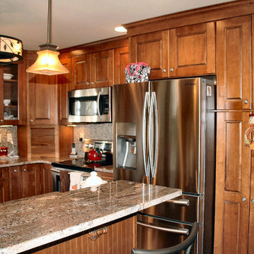 Traditional toffee kitchen remodel with multi-color mosaic tile back-splash