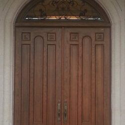 Traditional Long Paneled Door with Wrought Iron Transom - Front Doors