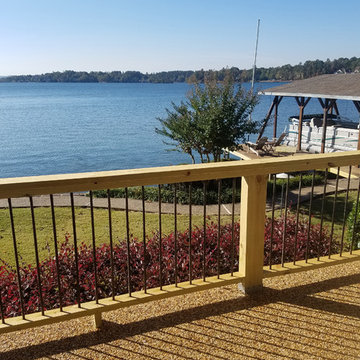 Exterior handrail constructed of treated wood and coated rebar