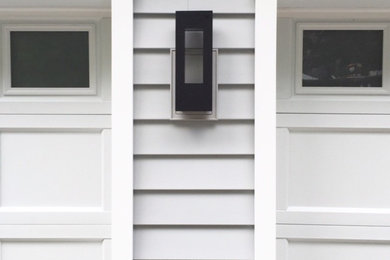 Mid-sized transitional attached two-car garage photo in New York