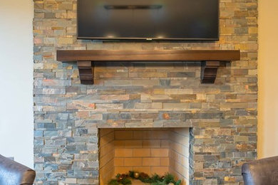Stacked stone fireplace wall construction from start to completion.