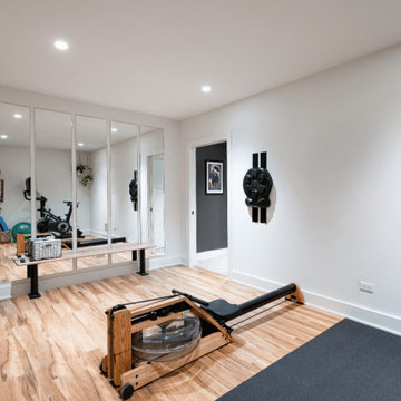 Modern Basement Workout Room with Full-Length Wall Mirrors