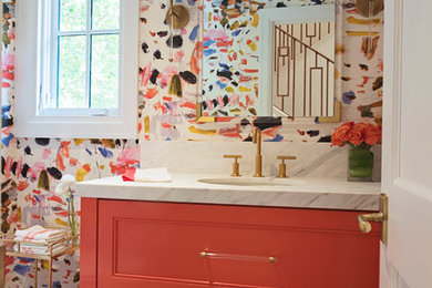 Mid-sized transitional medium tone wood floor and brown floor powder room photo in Other with multicolored walls, an undermount sink and marble countertops
