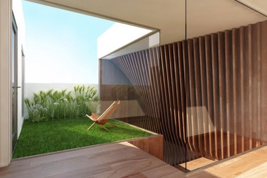 Large wooden curved staircase photo in Los Angeles