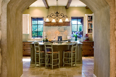 Large tuscan u-shaped travertine floor kitchen photo in Phoenix with a double-bowl sink, medium tone wood cabinets, granite countertops, beige backsplash, ceramic backsplash, stainless steel appliances and an island