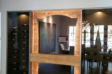 Inspiration for a mid-sized modern dark wood floor wine cellar remodel in Minneapolis