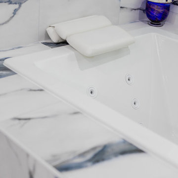 Bathroom remodeling in Columbia, MD with double vanity & marble bathtub