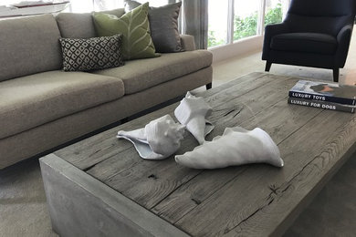 Inspiration for a small modern formal and open concept carpeted and beige floor living room remodel in Other with gray walls