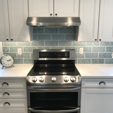 Kennett Square PA, Emerstone Carrara Lisco Quartz, on WayPoint Linen Cabinets.