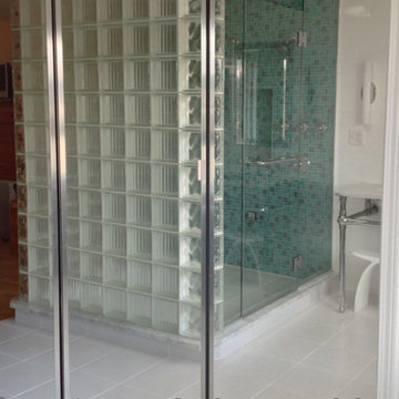 Mirrored closet in a Master Bathroom to Reflect Light and Increase feeling of sp