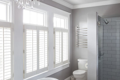 Example of a large classic master black and white tile and mosaic tile marble floor bathroom design in New Orleans with an undermount sink, furniture-like cabinets, gray cabinets, a two-piece toilet and gray walls