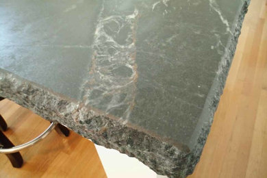 Soapstone Island with laminated Chiseled edge and rust-colored veins