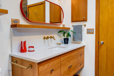 Inspiration for a small mid-century modern master brown tile and wood-look tile porcelain tile, gray floor, single-sink and vaulted ceiling bathroom remodel with flat-panel cabinets, medium tone wood cabinets, a bidet, white walls, an undermount sink, quartz countertops, a hinged shower door, white countertops, a niche and a floating vanity