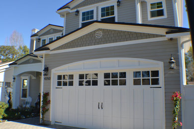 Inspiration for a mid-sized timeless gray two-story concrete fiberboard exterior home remodel in Los Angeles with a shingle roof