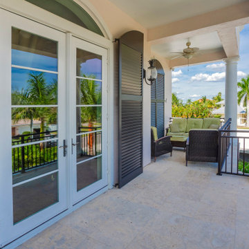 Refined Balcony Oasis with Classical Columns and Garden Views
