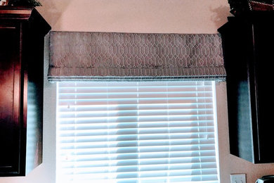 Custom Window Treatments in Shades of Gray  2" blinds with a faux roman valance.