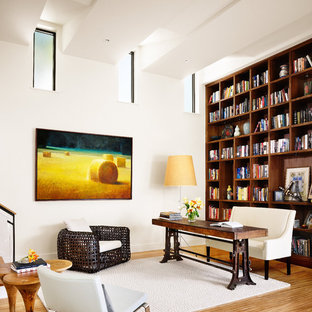 Industrial home office in Austin with bamboo floors.