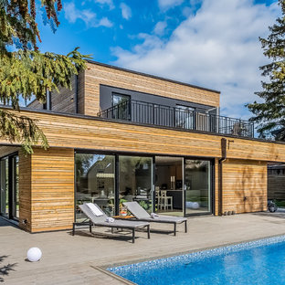 Inspiration för en funkis rektangulär pool på baksidan av huset