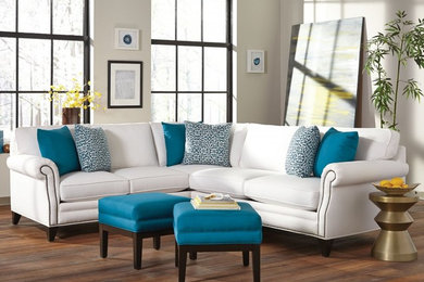 Example of a mid-sized transitional formal and loft-style medium tone wood floor living room design in Los Angeles with white walls