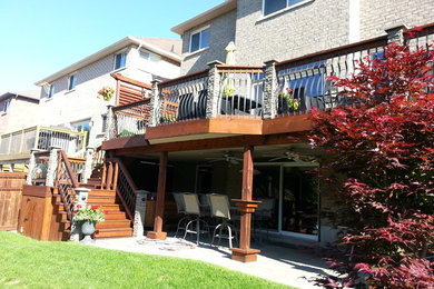 Photo of a large transitional backyard deck in Toronto with no cover.