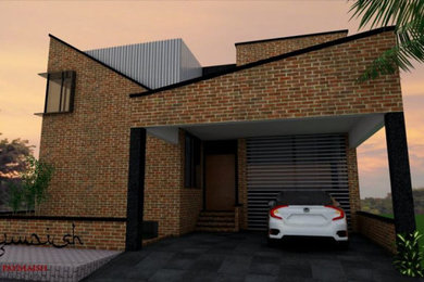 Modern red two-story brick exterior home idea in Toronto with a mixed material roof