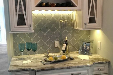 Example of a transitional home bar design in Miami