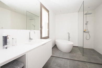 Inspiration for a modern bathroom in Other with a freestanding tub.