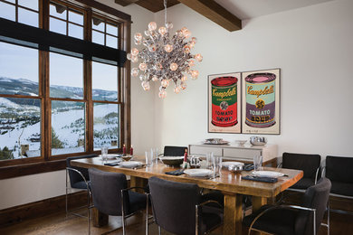Dining room - rustic dark wood floor dining room idea in Other with white walls