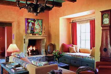 Example of a mid-sized mountain style enclosed and formal concrete floor living room design in Phoenix with no tv, yellow walls, a standard fireplace and a stone fireplace