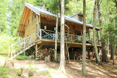 Inspiration for a mid-sized craftsman brown two-story wood gable roof remodel in Ottawa