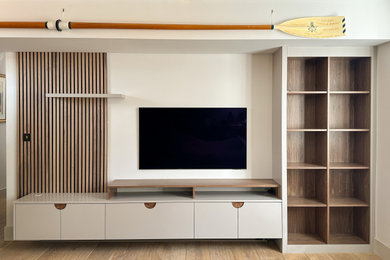 This is an example of a contemporary living room in West Midlands with a built-in media unit.