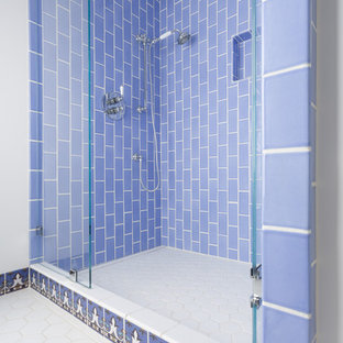 Shower in Sky Blue 3x6 subway tile with hexes on the floor.