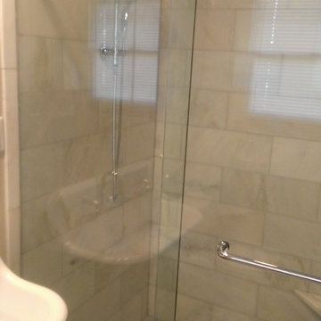 BATHROOM - Calcutta Gold Marble Shower / Gray Penny Tile Floor