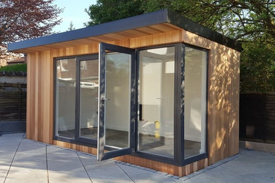 This is an example of a medium sized contemporary detached office/studio/workshop in Cheshire.