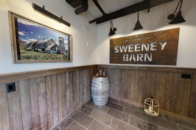 Inspiration for a rural foyer in DC Metro with slate flooring, a double front door, a black front door and grey floors.