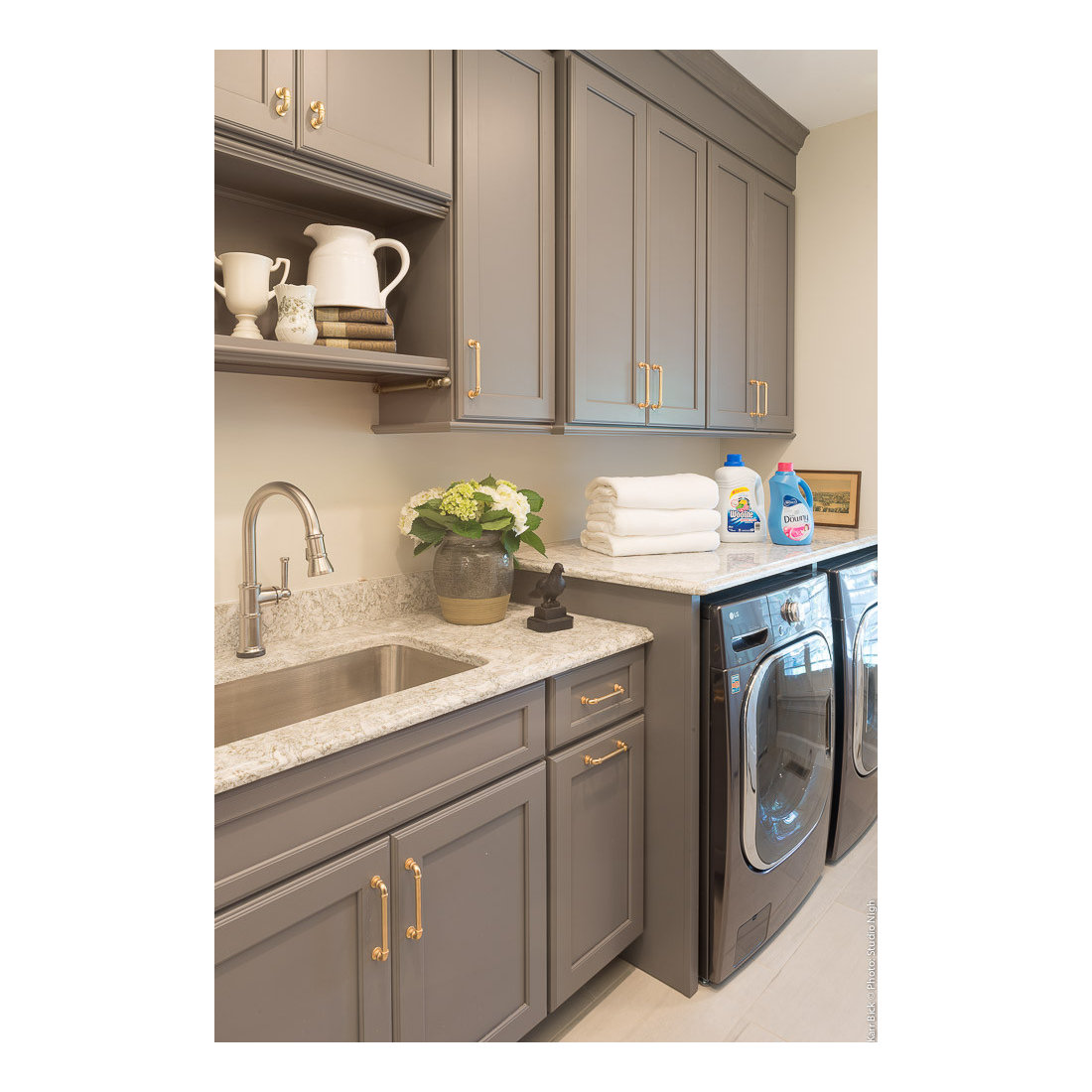 Gray Laundry Room with Brass Hardware