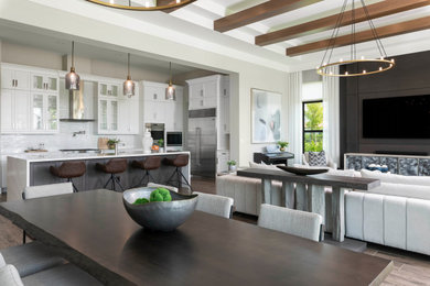 Transitional medium tone wood floor and exposed beam kitchen photo in Other with a farmhouse sink, shaker cabinets, white cabinets, quartzite countertops, white backsplash, glass tile backsplash and white countertops