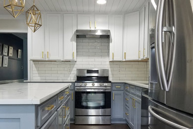 Design ideas for a mid-sized modern galley kitchen in Atlanta with shaker cabinets, ceramic splashback, stainless steel appliances and with island.