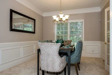 Example of a transitional dining room design in Charlotte