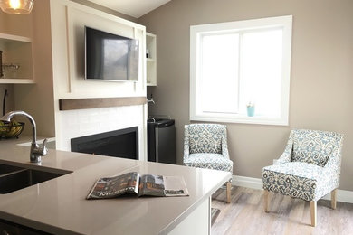 Inspiration for a mid-sized transitional u-shaped vinyl floor and multicolored floor eat-in kitchen remodel in Toronto with an undermount sink, shaker cabinets, white cabinets, quartz countertops, beige backsplash, ceramic backsplash, stainless steel appliances, a peninsula and beige countertops