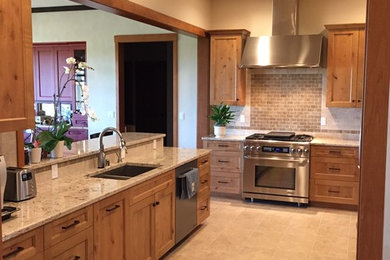Kitchen - large transitional ceramic tile kitchen idea in Seattle with ceramic backsplash, a double-bowl sink, shaker cabinets, medium tone wood cabinets and beige backsplash