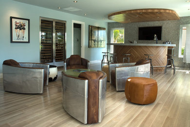 Photo of a contemporary family room in Miami with a home bar.