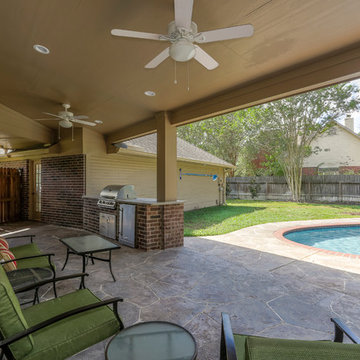 Stone Patio with Outdoor Kitchen and Pool