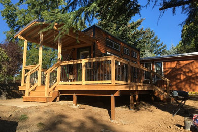 This is an example of a mid-sized contemporary deck in Portland.