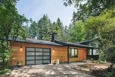 Mid-century modern brown one-story wood house exterior photo in Portland with a hip roof and a shingle roof